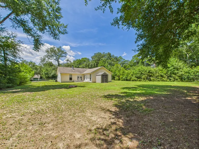 a view of a house with a big yard