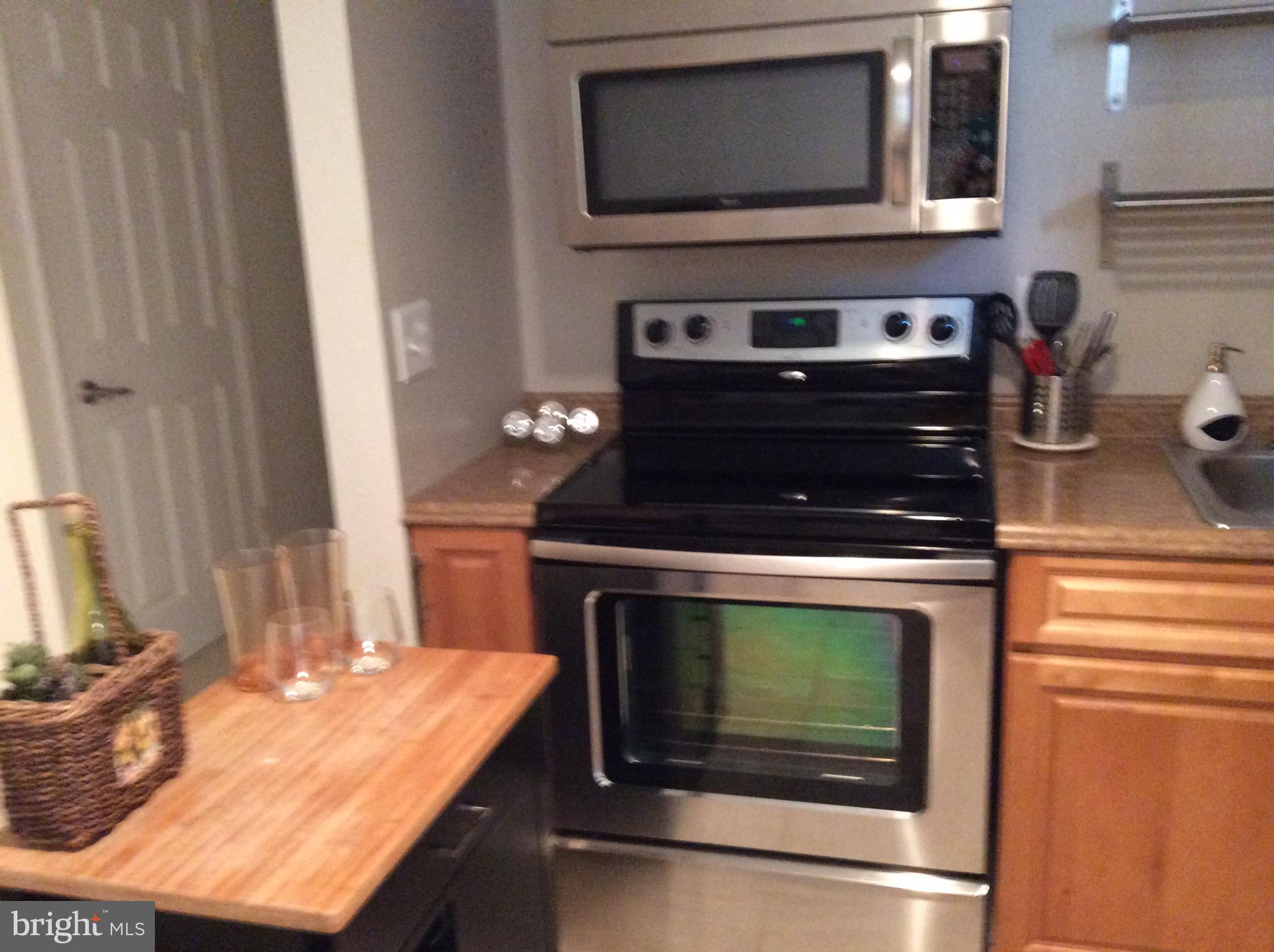 a kitchen with a stove and a microwave