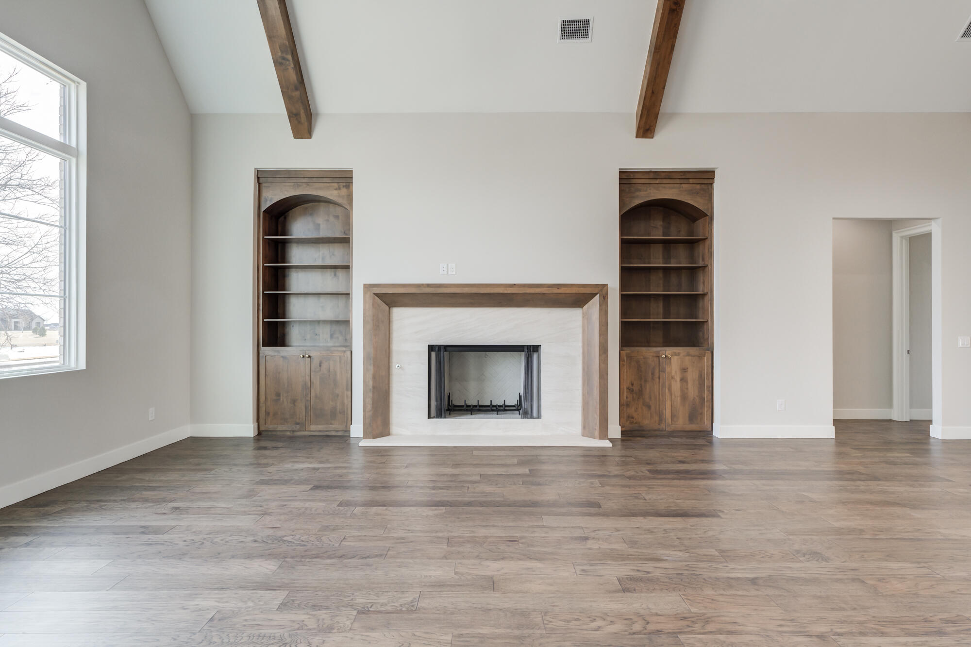 14102 Salisbury Avenue Lubbock, TX 79424 - Photo 11 of 76 a view of empty room with a fireplace and window