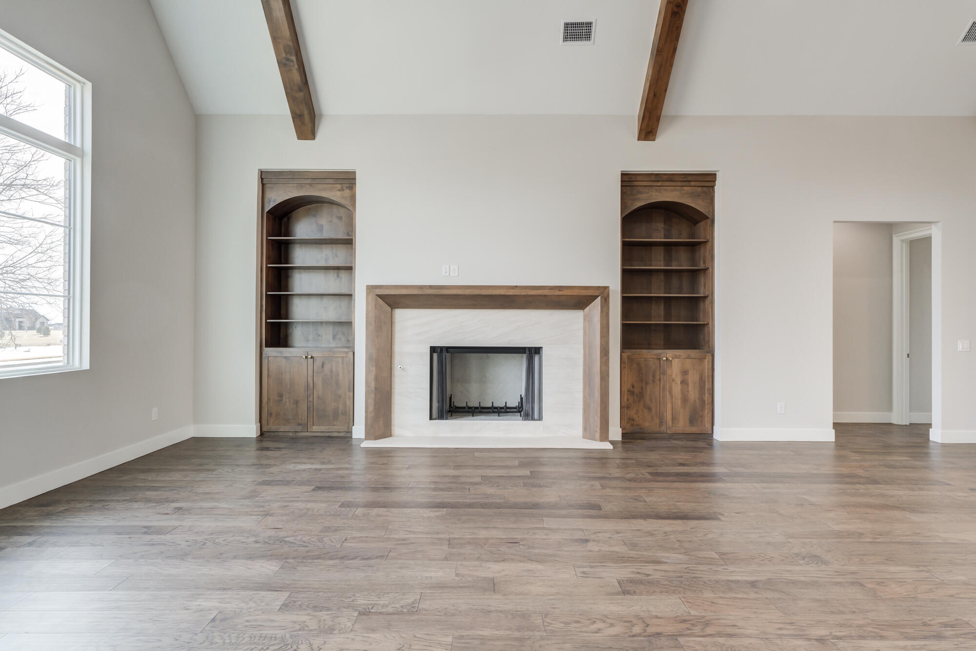 14102 Salisbury Avenue Lubbock, TX 79424 - Photo 44 of 76 a view of empty room with a fireplace and window