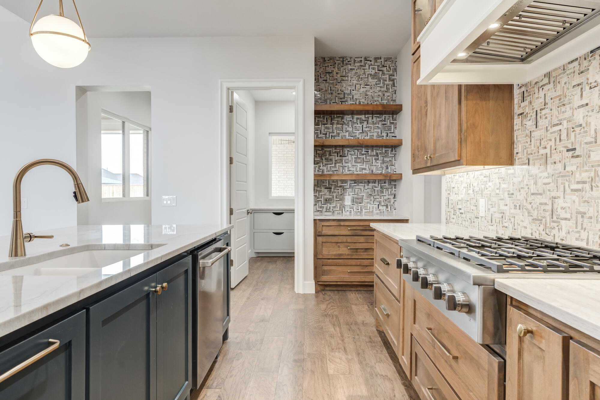 14102 Salisbury Avenue Lubbock, TX 79424 - Photo 54 of 76 a kitchen with stainless steel appliances granite countertop a stove a sink and a refrigerator