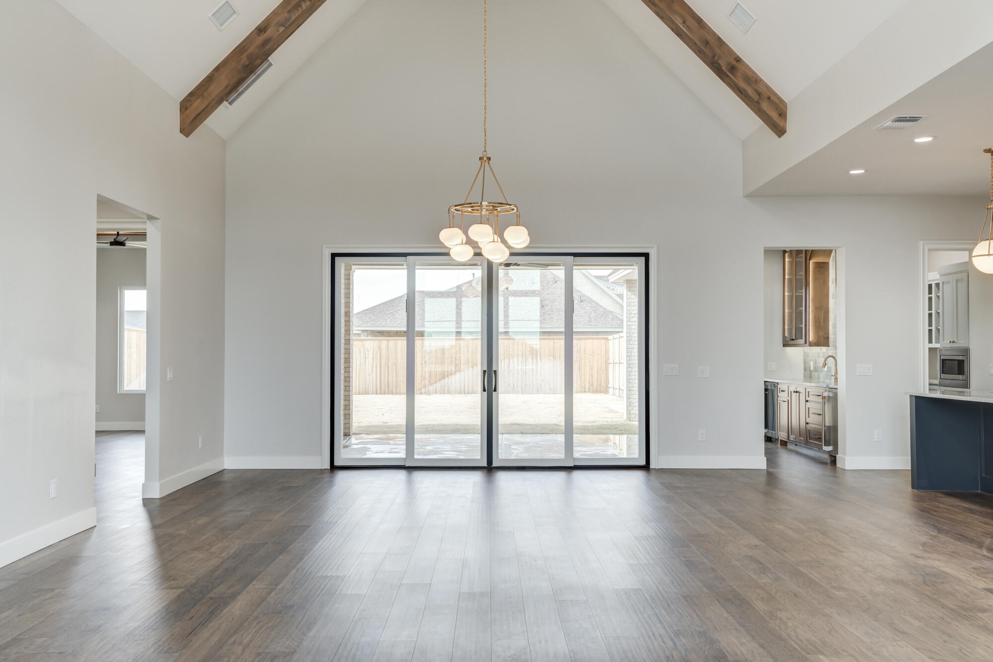 14102 Salisbury Avenue Lubbock, TX 79424 - Photo 71 of 76 a view of an empty room with wooden floor and a window