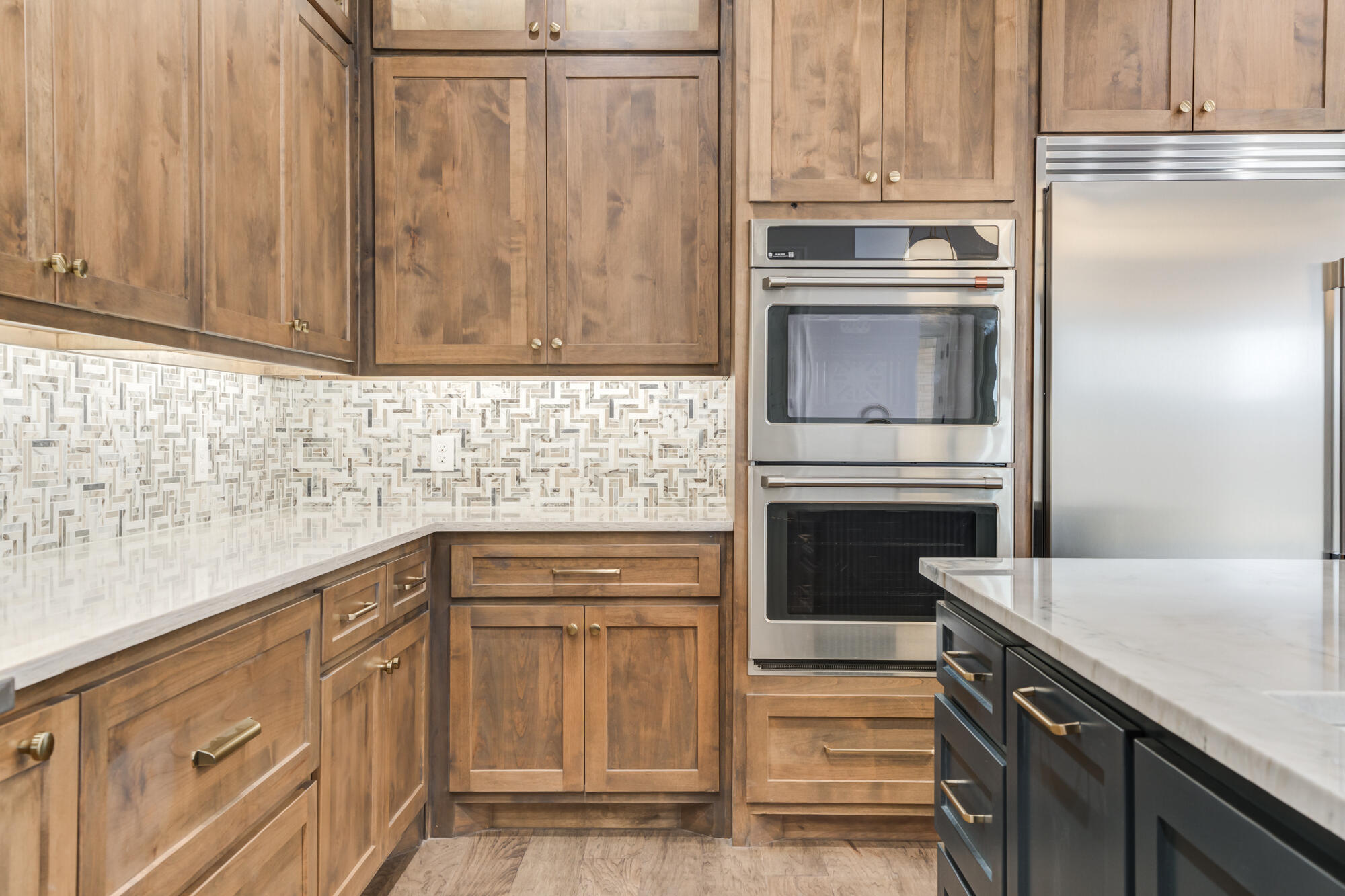 14102 Salisbury Avenue Lubbock, TX 79424 - Photo 74 of 76 a kitchen with granite countertop white cabinets and stainless steel appliances