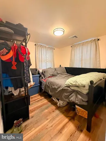 a bedroom with a bed and a closet