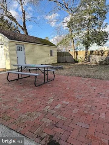 a view of a backyard with sitting area