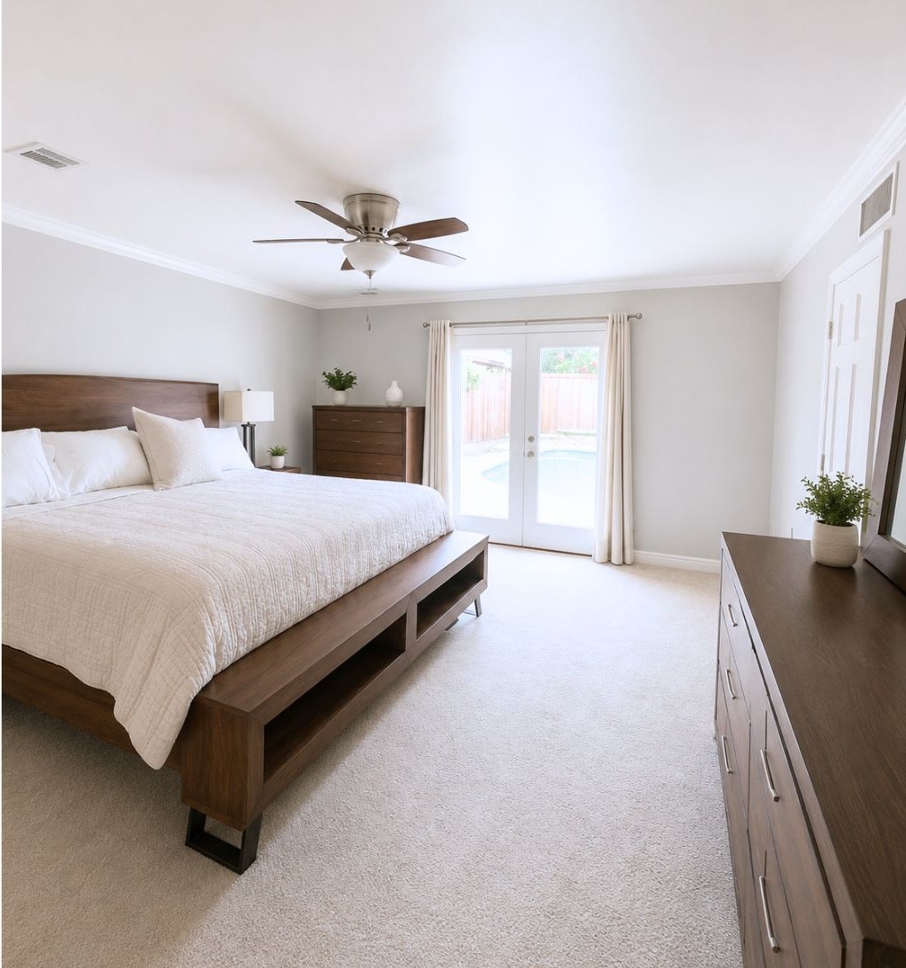 13047 Taylorcrest Road Houston, TX 77079 - Photo 15 of 23 The spacious primary suite offers a peaceful retreat with room for a sitting area, French doors providing direct access to the backyard, & wonderful natural light.