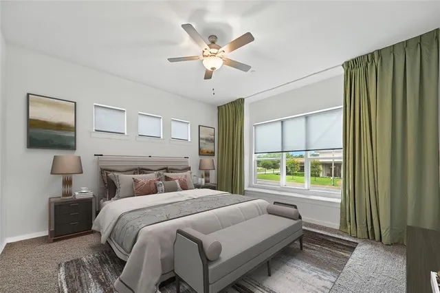 a bedroom with bed and a potted plant