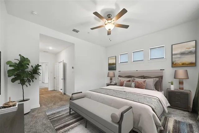 a bedroom with a large bed and a window