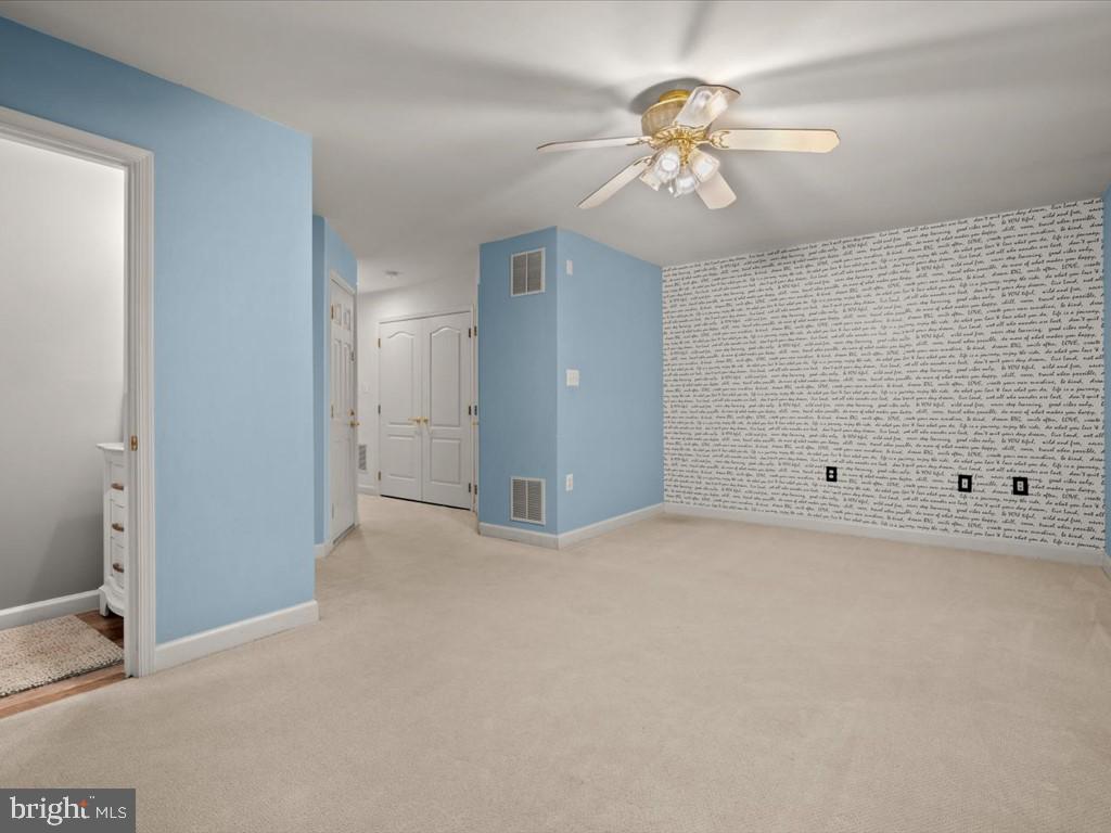 123 Rivanna Terrace Southwest Leesburg, VA 20175 - Photo 32 of 53 Recreation rm w/ceiling fan and accent wall