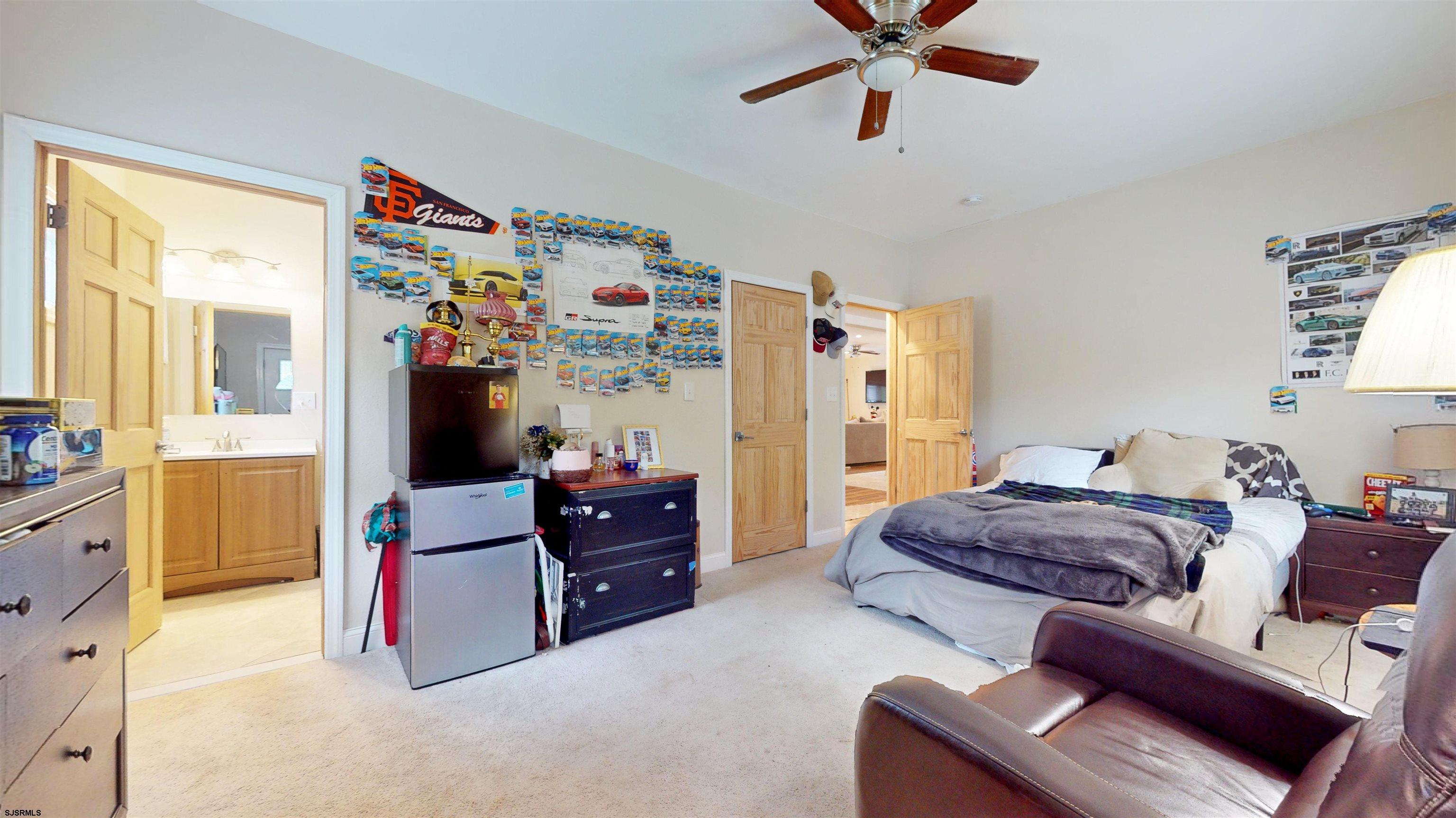 181 3rd Estell Manor, NJ 08319 - Photo 13 of 34 a living room with furniture and a window