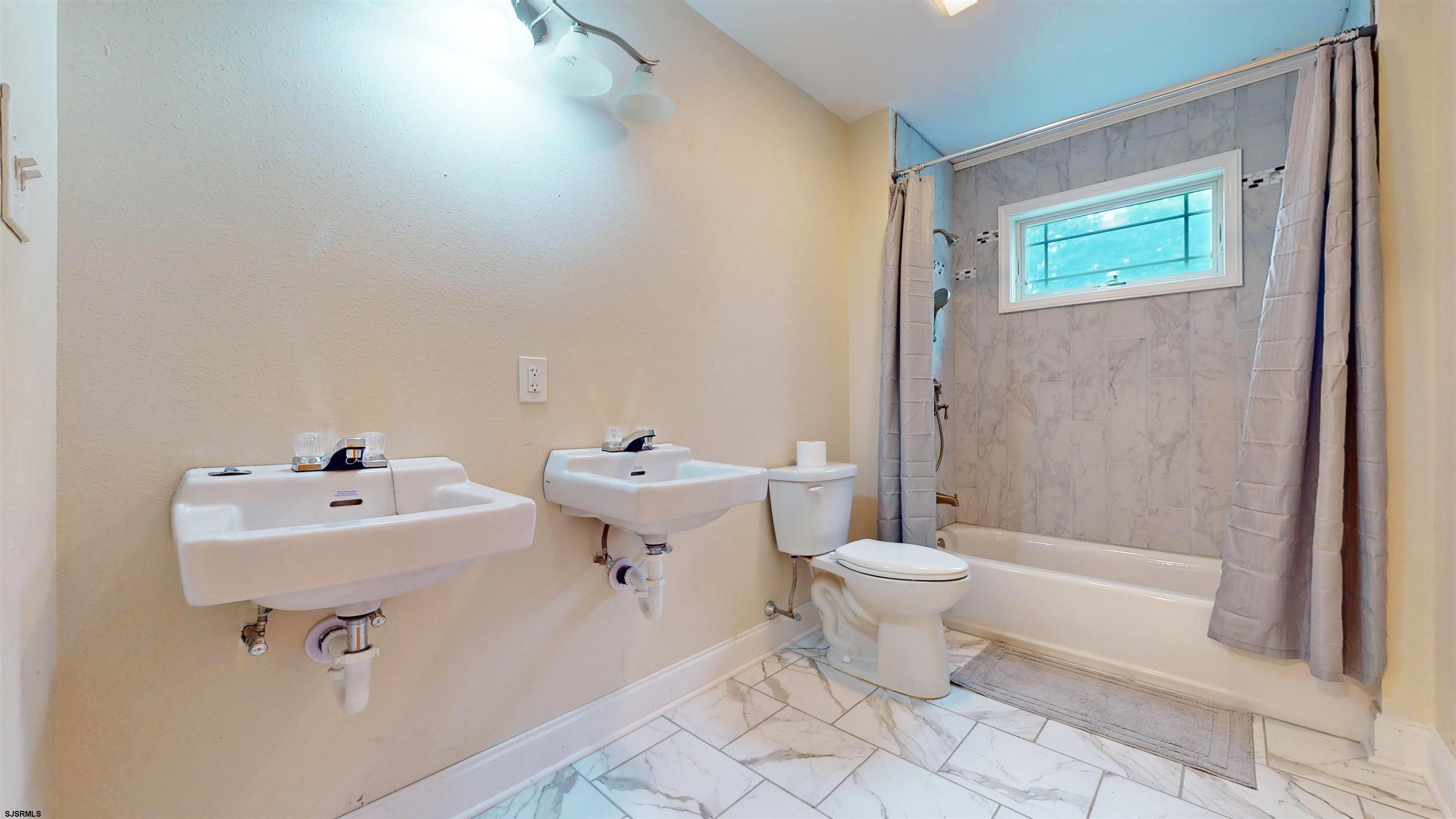 181 3rd Estell Manor, NJ 08319 - Photo 16 of 34 a bathroom with a sink toilet and shower