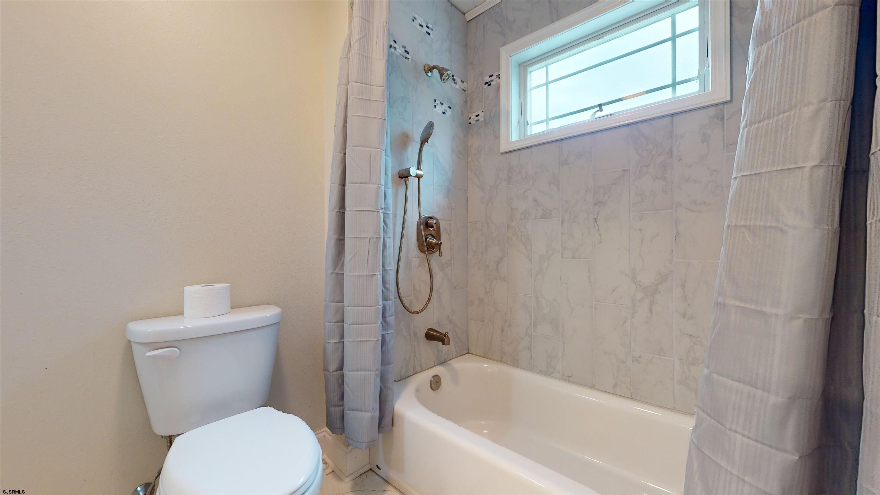 181 3rd Estell Manor, NJ 08319 - Photo 17 of 34 a bathroom with a toilet and shower