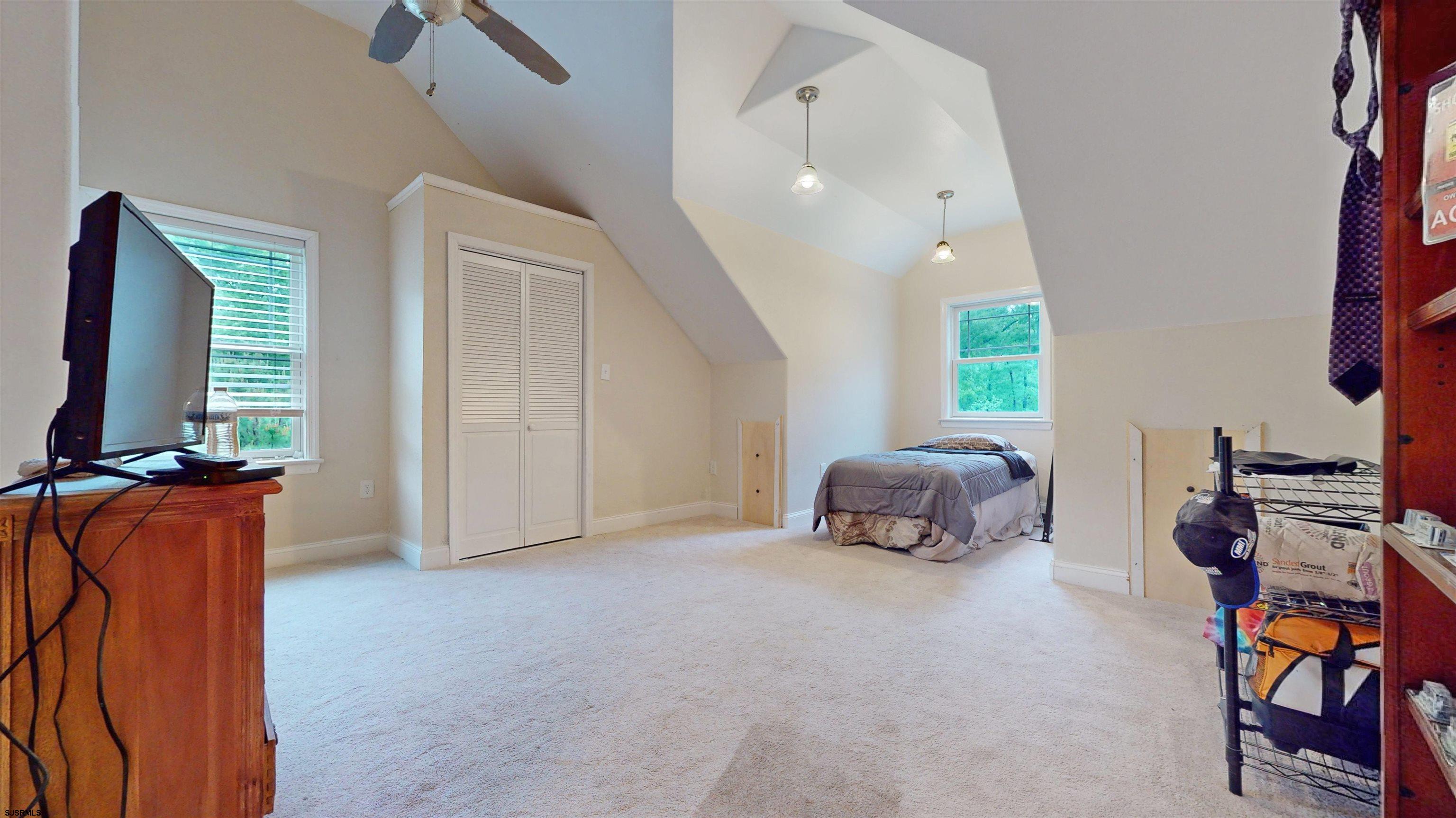 181 3rd Estell Manor, NJ 08319 - Photo 18 of 34 a bedroom with furniture and a window