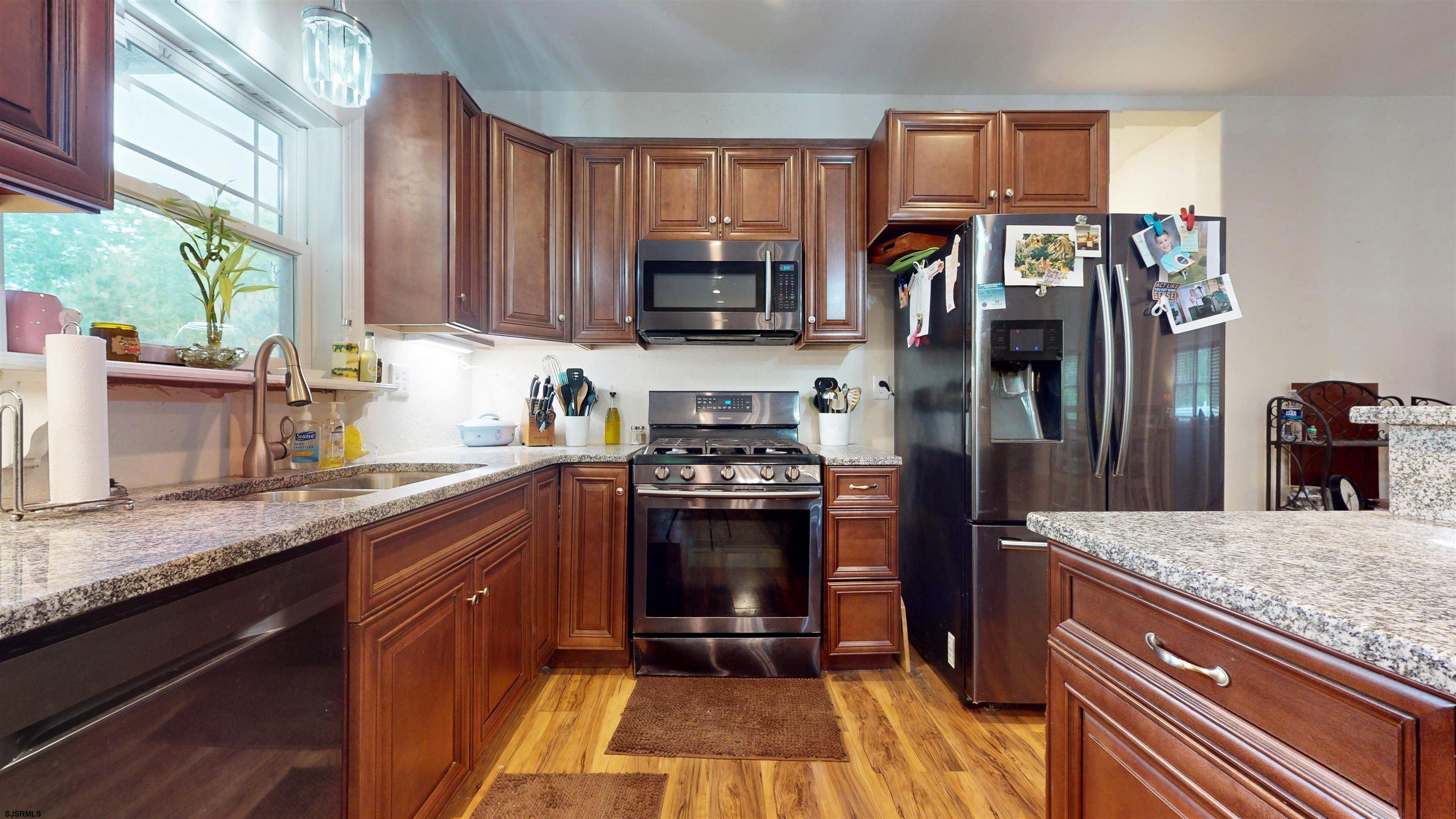 181 3rd Estell Manor, NJ 08319 - Photo 7 of 34 a kitchen with stainless steel appliances granite countertop a refrigerator and a sink