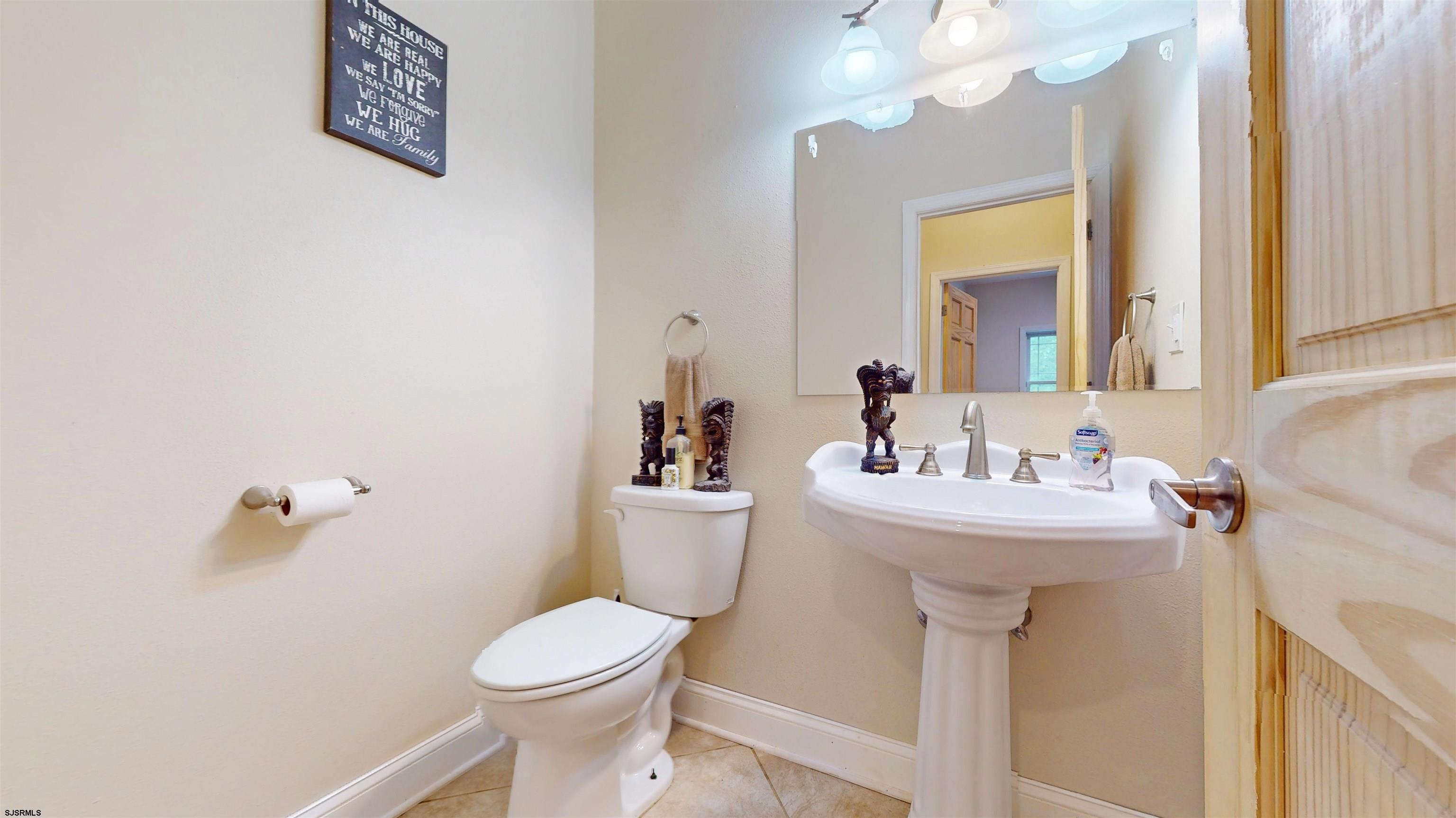 181 3rd Estell Manor, NJ 08319 - Photo 10 of 34 a bathroom with a sink mirror and toilet