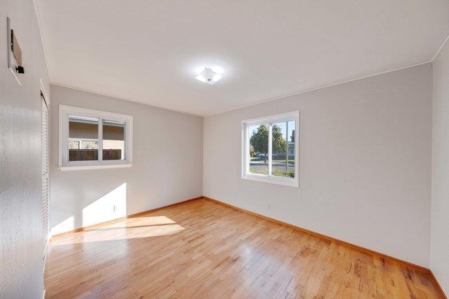 1024 West Riverside Way San Jose, CA 95129 - Photo 13 of 31 a view of an empty room with wooden floor and a window