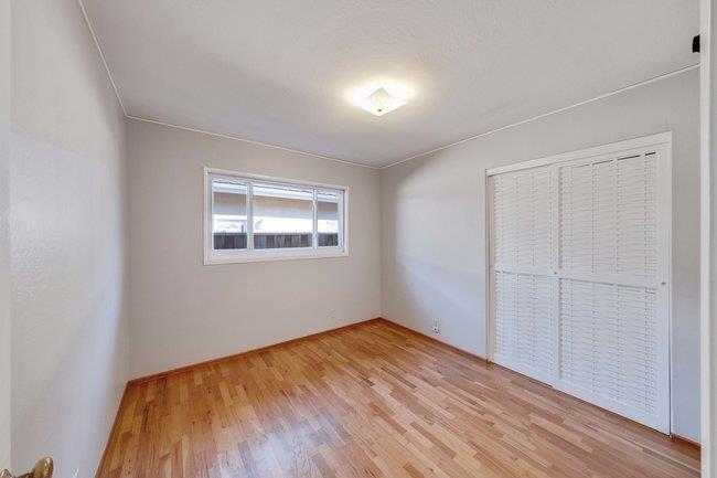 1024 West Riverside Way San Jose, CA 95129 - Photo 16 of 31 wooden floor in an empty room with a window