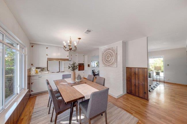 1024 West Riverside Way San Jose, CA 95129 - Photo 4 of 31 a view of a dining room with furniture window and wooden floor