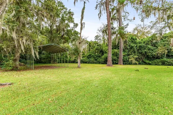 a backyard of a house with lots of green space