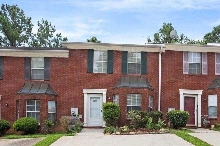 5739 Windfall Lane Lithonia, GA 30058 - Photo 1 of 36 front view of a brick house with a yard