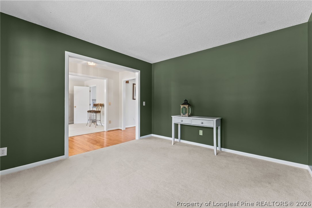 203 White Oak Church Road Clinton, NC 28328 - Photo 19 of 49 a bedroom with a bed and a table