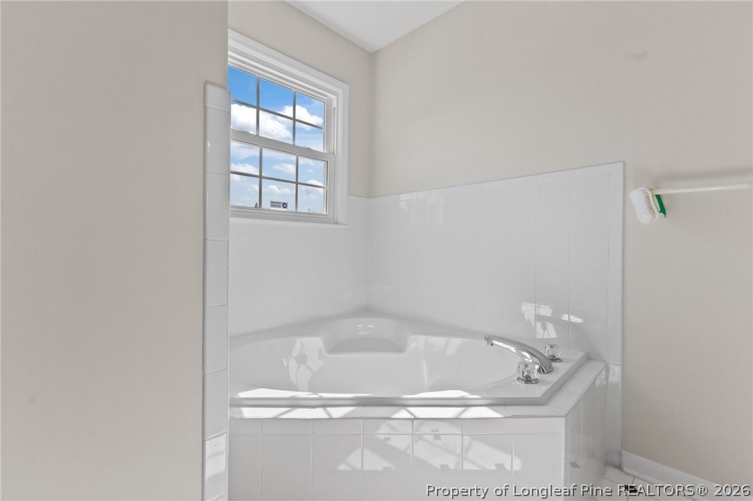 203 White Oak Church Road Clinton, NC 28328 - Photo 29 of 49 a bath tub sitting next to a window