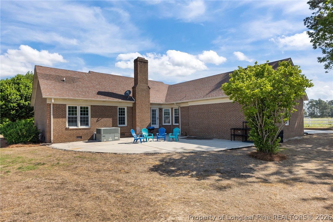 203 White Oak Church Road Clinton, NC 28328 - Photo 33 of 49 a house view with a sitting space and garden space