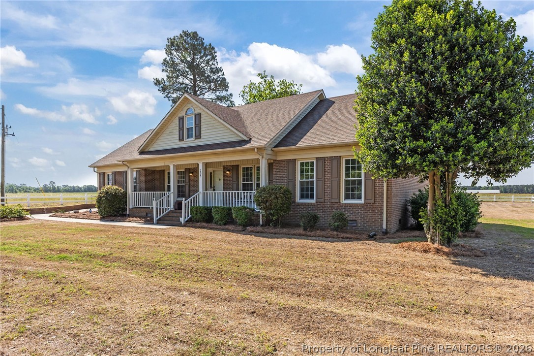 203 White Oak Church Road Clinton, NC 28328 - Photo 34 of 49 a front view of a house with a yard
