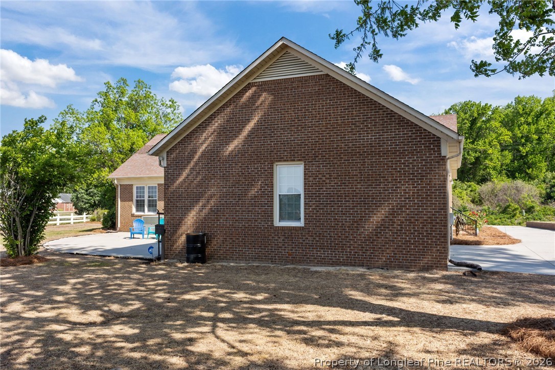 203 White Oak Church Road Clinton, NC 28328 - Photo 37 of 49 a front view of a house with a yard