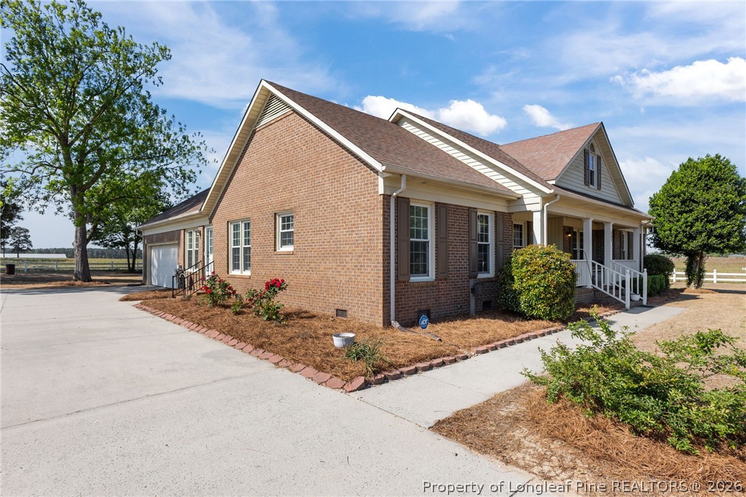 203 White Oak Church Road Clinton, NC 28328 - Photo 41 of 49 a front view of house with yard and trees around
