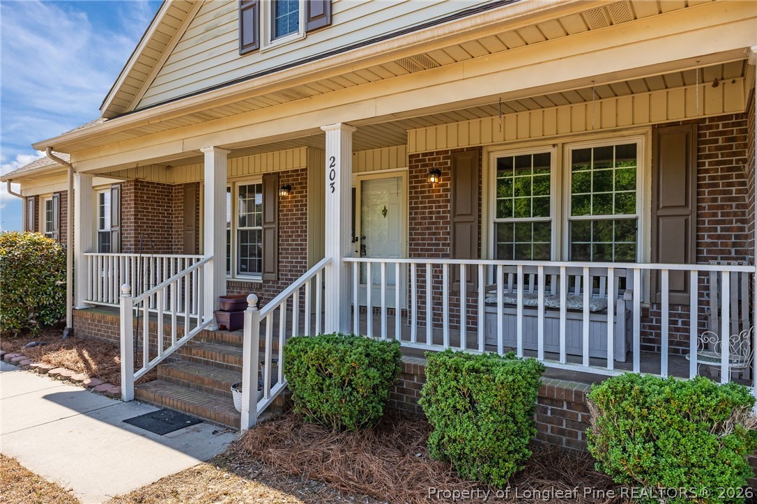 203 White Oak Church Road Clinton, NC 28328 - Photo 43 of 49 a view of a house with a small deck and wooden floor