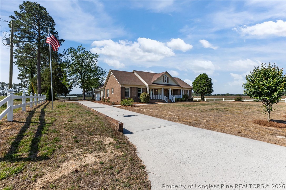 203 White Oak Church Road Clinton, NC 28328 - Photo 44 of 49 a view of house with outdoor space