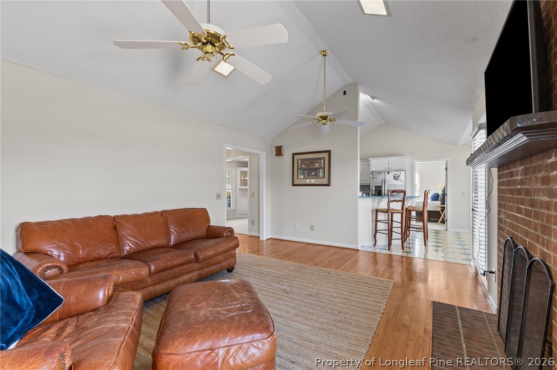 203 White Oak Church Road Clinton, NC 28328 - Photo 10 of 49 a living room with furniture and a fireplace