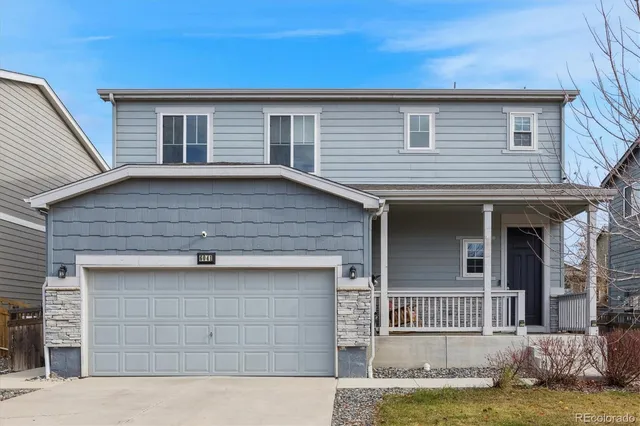 a front view of a house with a garage