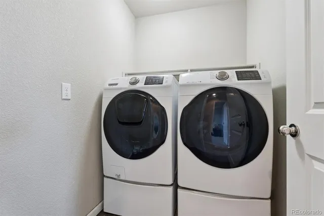 a utility room with dryer and washer
