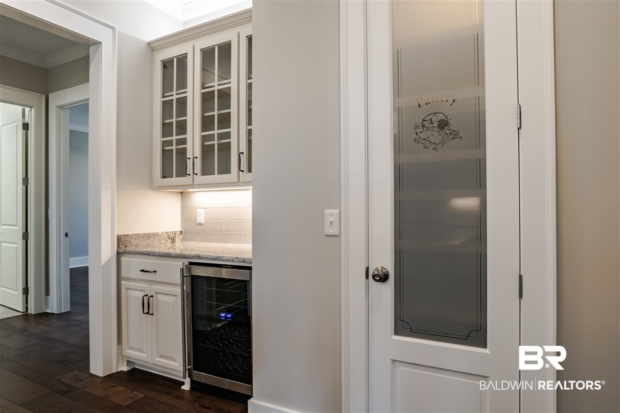 32090 River Cove Orange Beach, AL 36561 - Photo 16 of 28 Custom pantry door, wine cooler