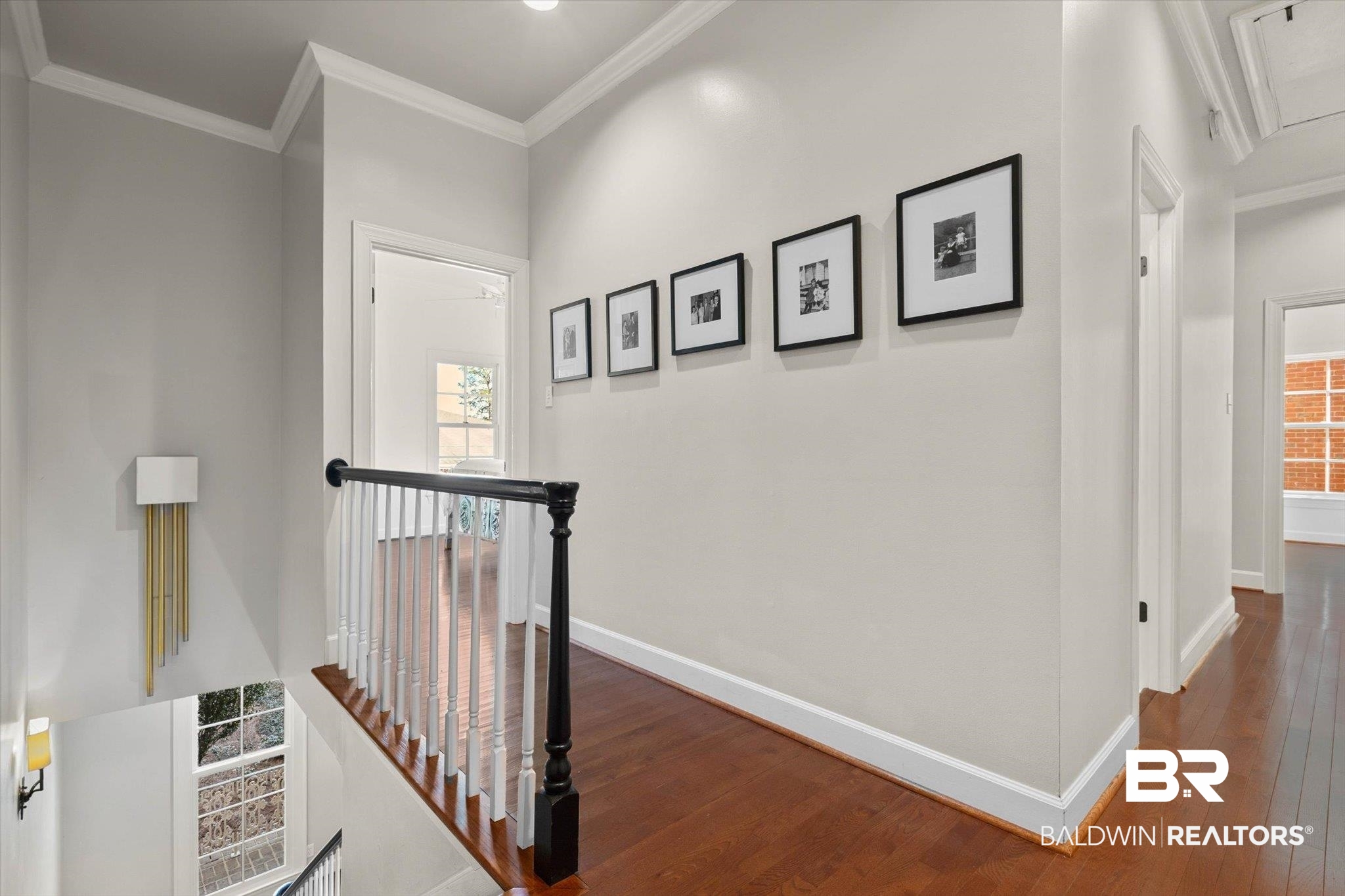 3615 Stein Street Mobile, AL 36608 - Photo 19 of 44 Corridor featuring an upstairs landing, crown molding, wood-type flooring, and attic access