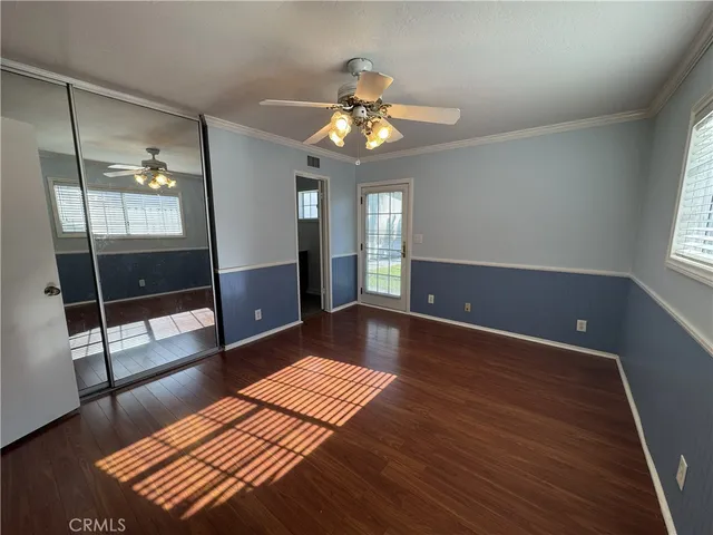 a view of a room with wooden floor