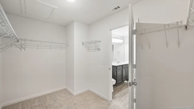 a view of a kitchen with a sink and cabinet