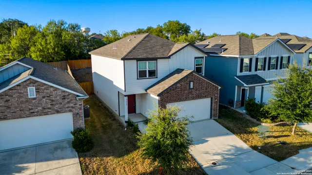 a aerial view of a house with a yard