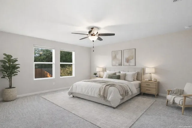 a bedroom with bed and a large window