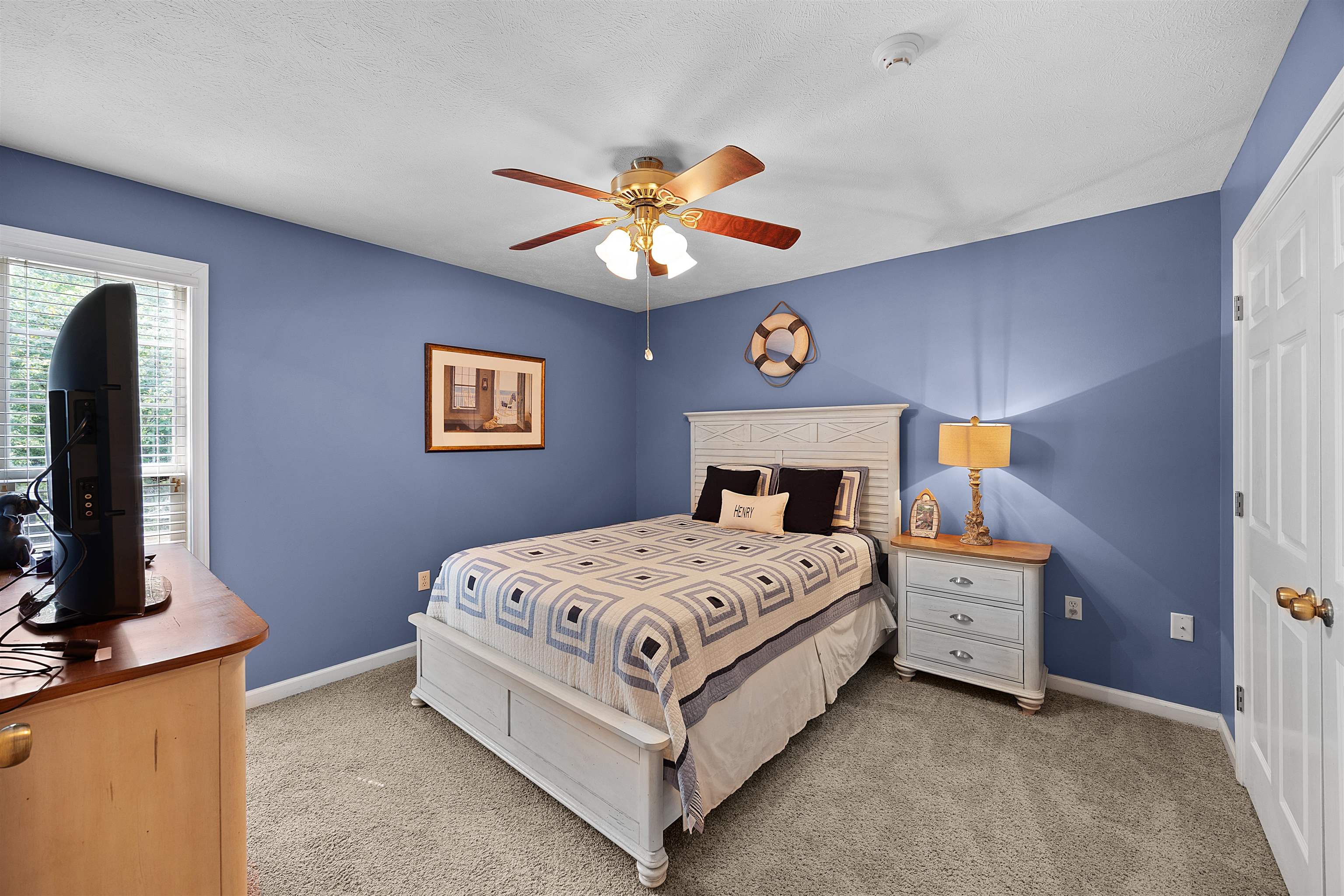 28 County Road 18 Iuka, MS 38852 - Photo 14 of 39 a bedroom with a bed and a chandelier