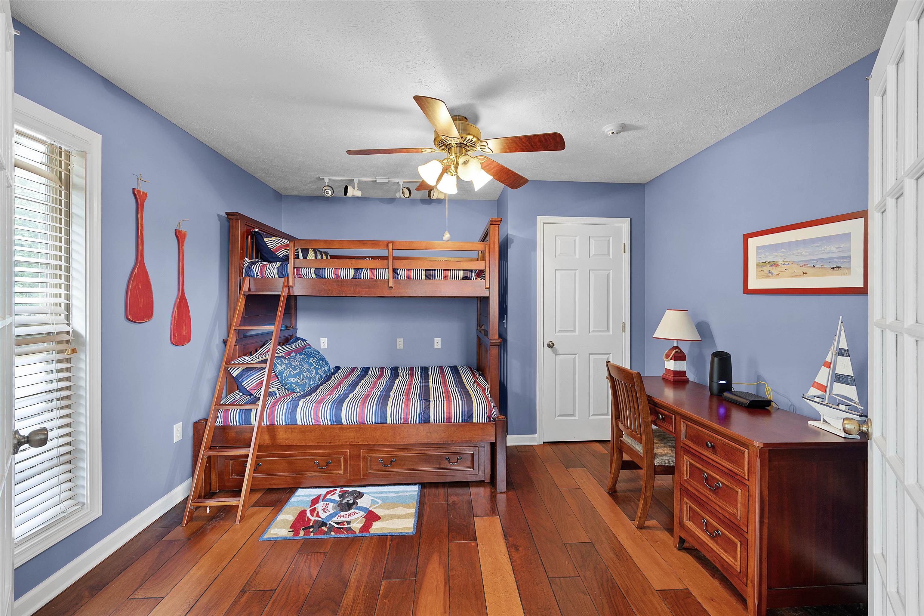 28 County Road 18 Iuka, MS 38852 - Photo 16 of 39 a bedroom with a bed and wooden floor