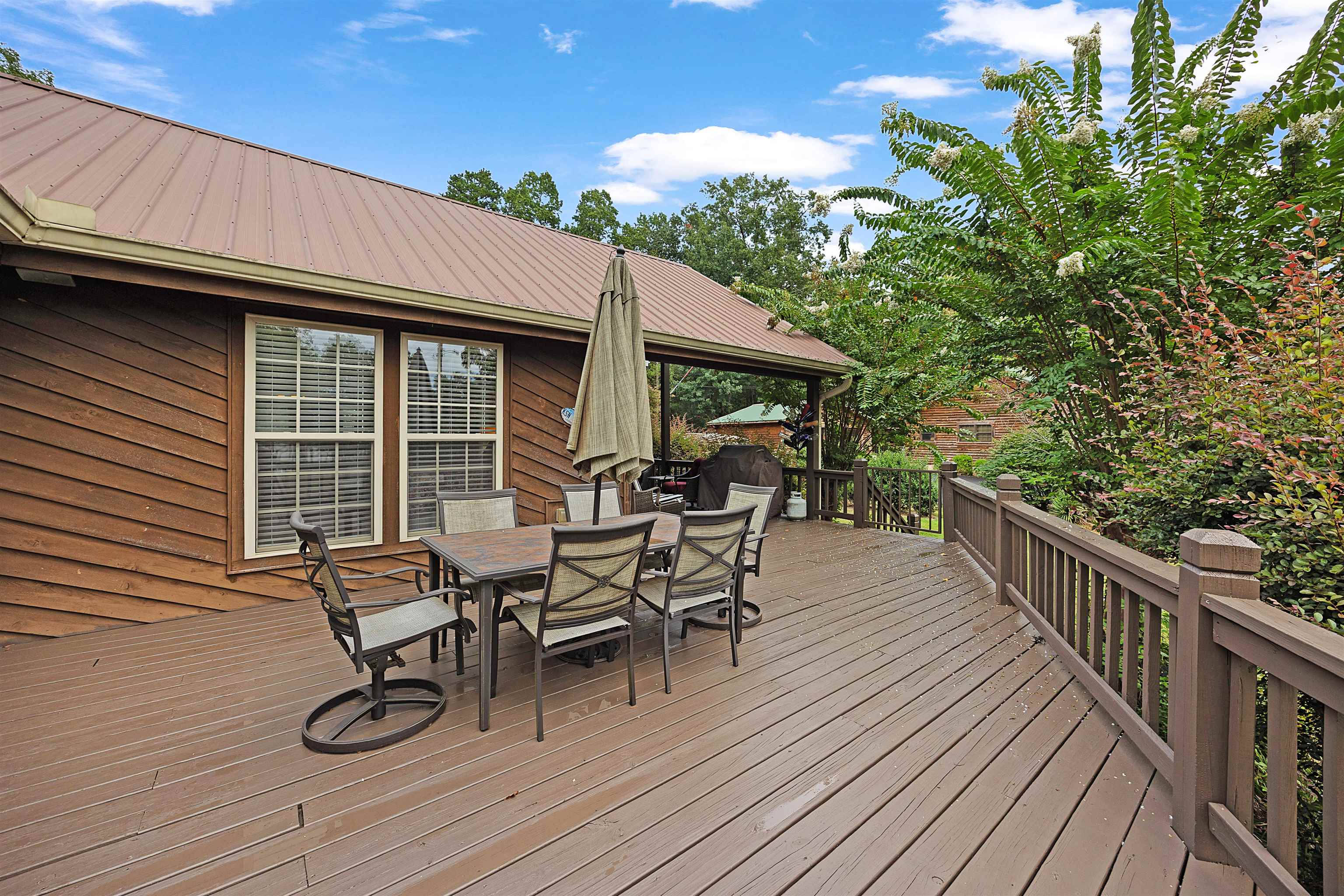 28 County Road 18 Iuka, MS 38852 - Photo 28 of 39 a view of a roof deck with table and chairs and wooden floor