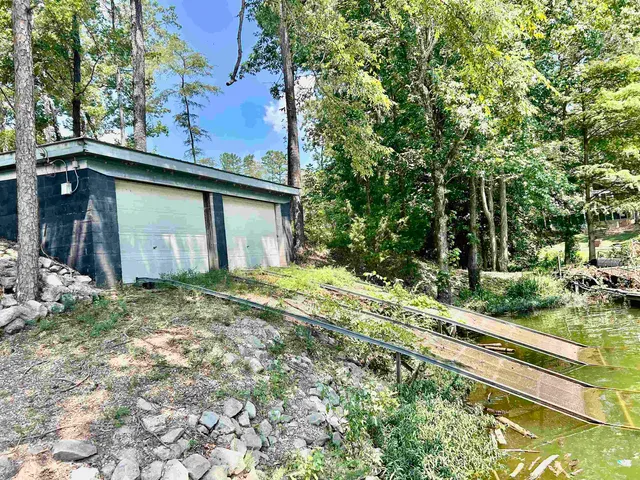 a house view with a backyard space