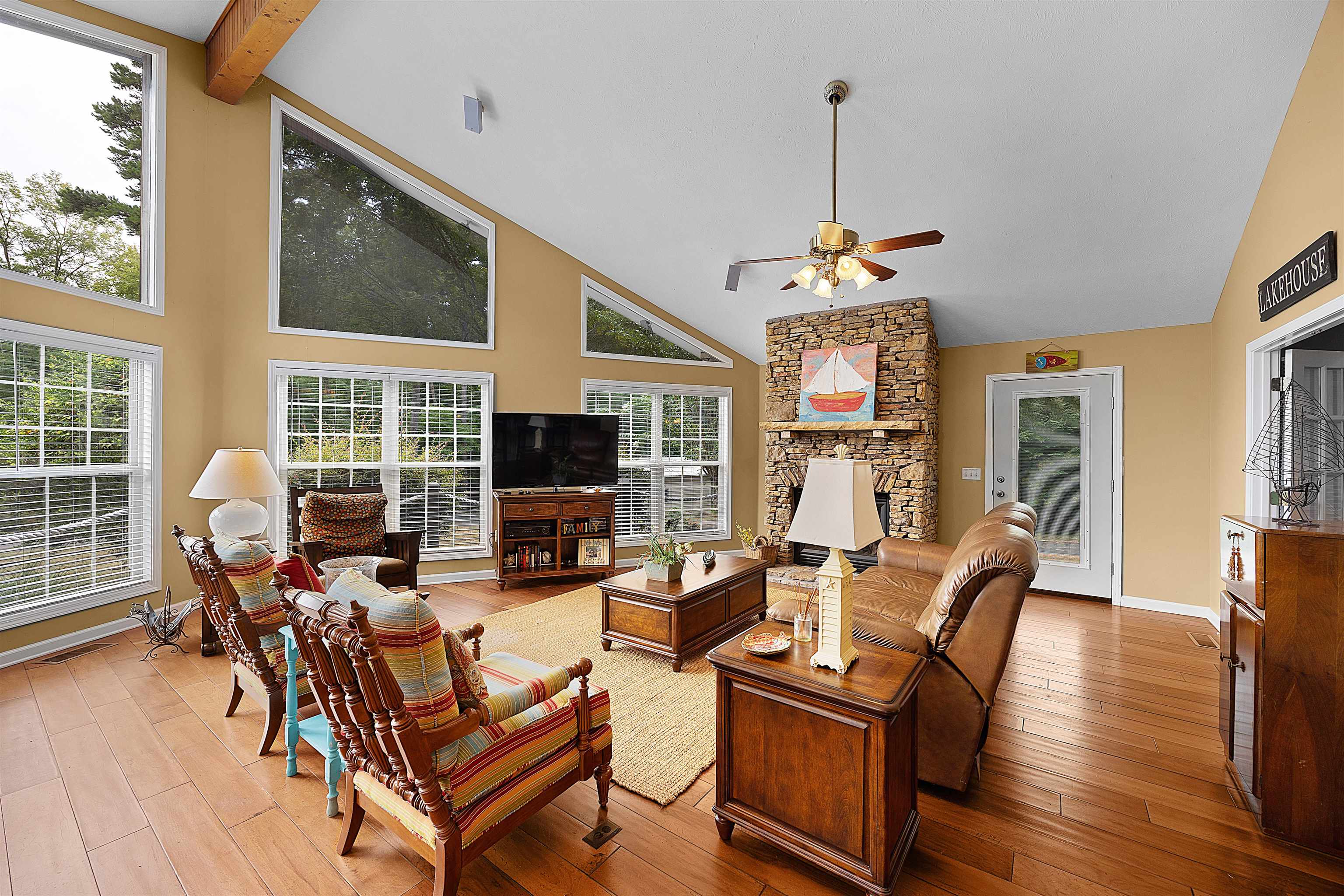 28 County Road 18 Iuka, MS 38852 - Photo 5 of 39 a living room with furniture a flat screen tv and a large window