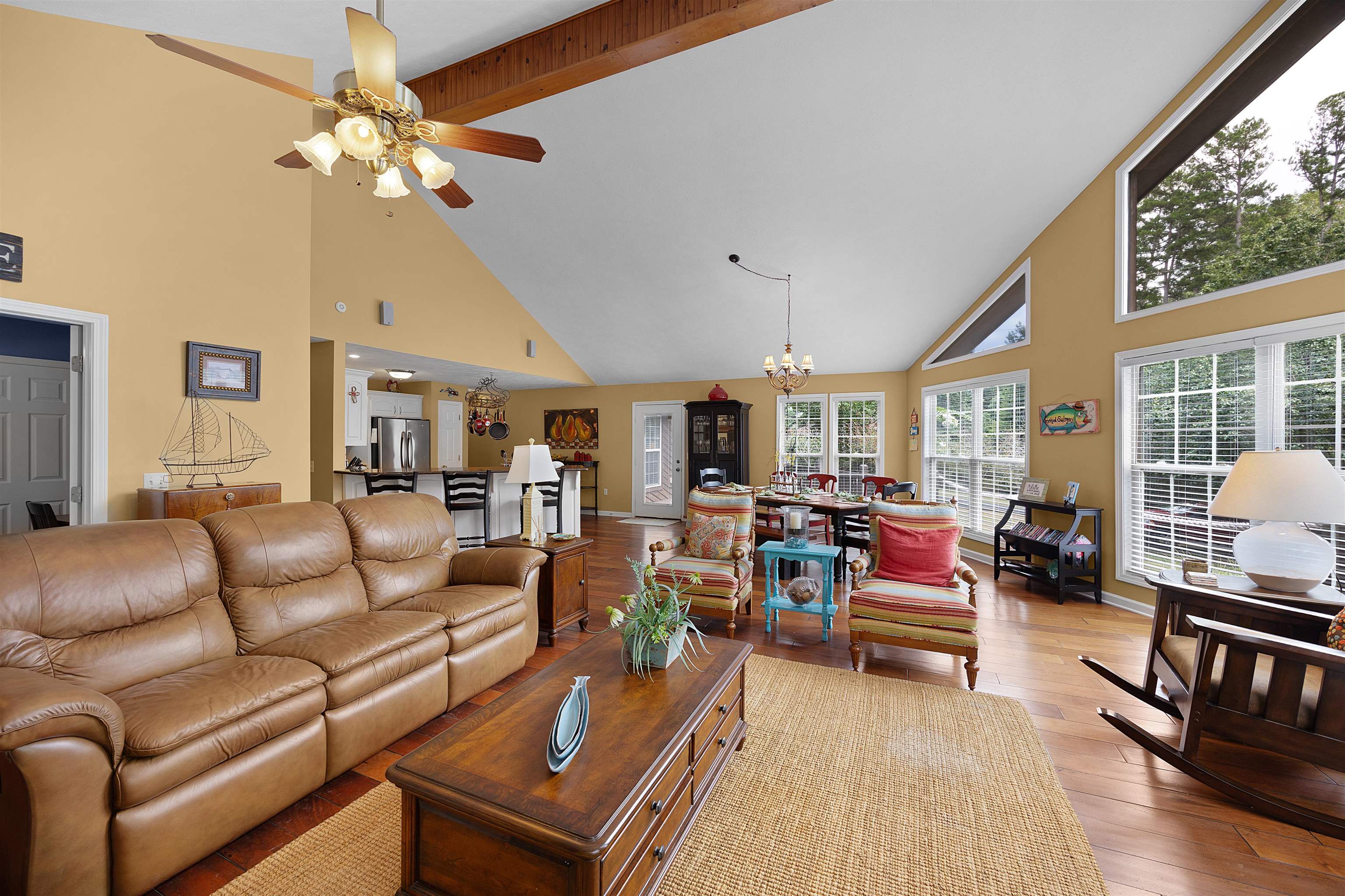 28 County Road 18 Iuka, MS 38852 - Photo 6 of 39 a living room with furniture a chandelier and a dining table with wooden floor