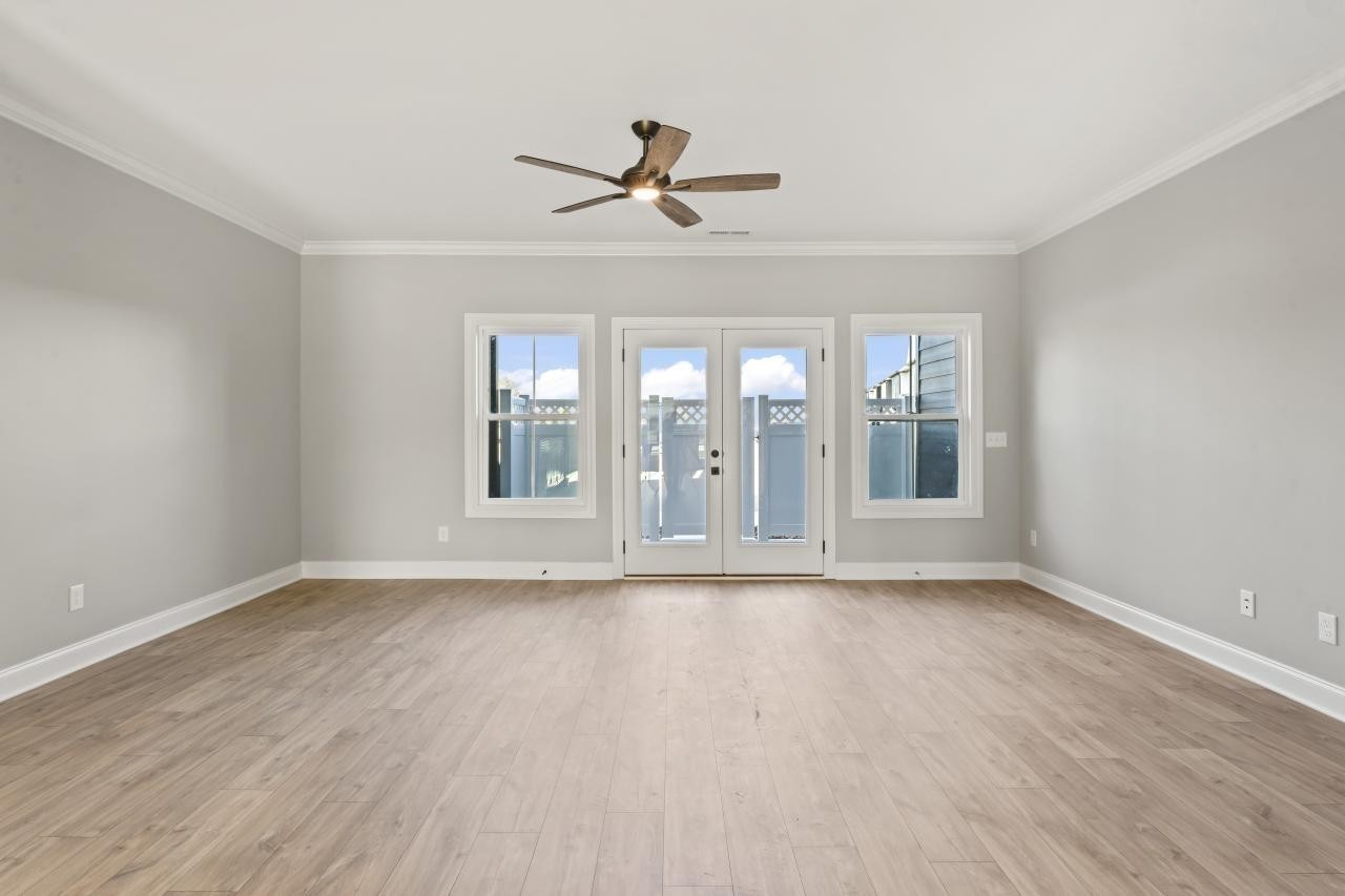 1341 Rebecca Johns Drive Murfreesboro, TN 37128 - Photo 16 of 32 a view of an empty room with a window and wooden floor
