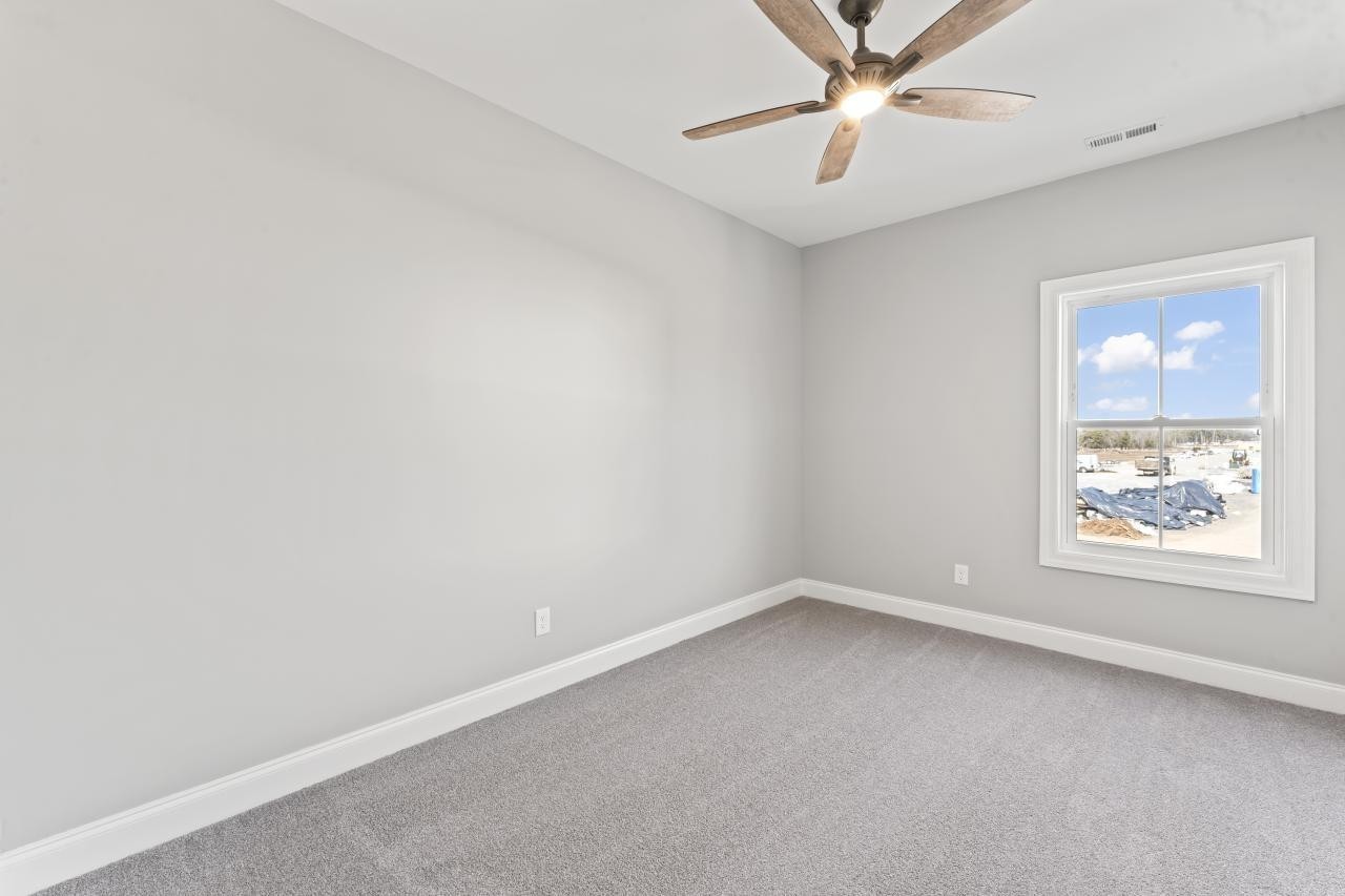 1341 Rebecca Johns Drive Murfreesboro, TN 37128 - Photo 20 of 32 an empty room with a window and a fan
