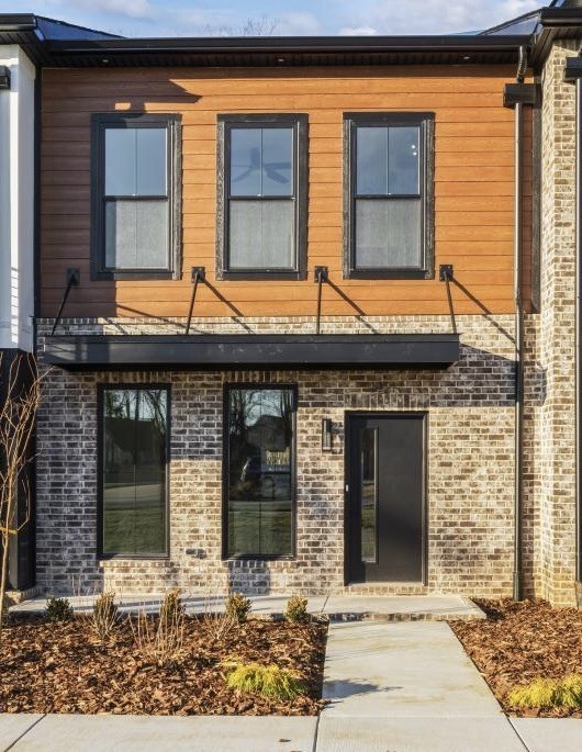 1341 Rebecca Johns Drive Murfreesboro, TN 37128 - Photo 6 of 32 a brick building with a large windows